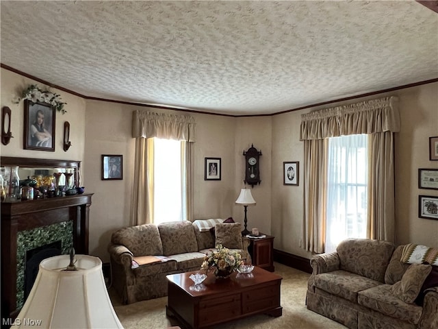 carpeted living room with a premium fireplace, a textured ceiling, and a healthy amount of sunlight