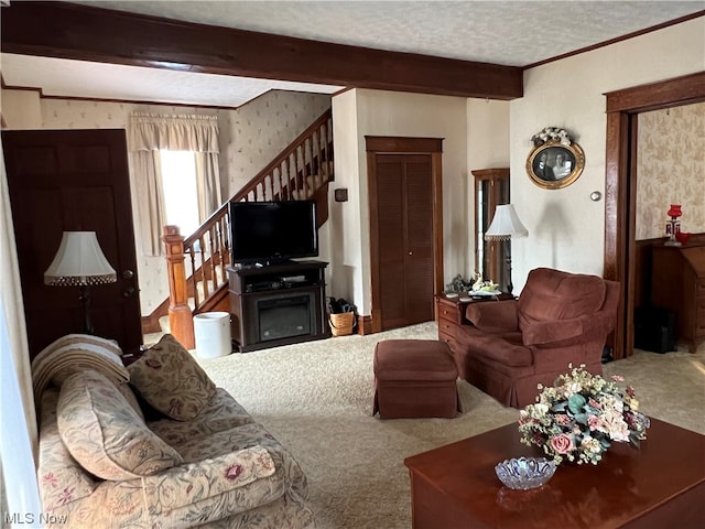 living room with beamed ceiling, carpet, and a textured ceiling