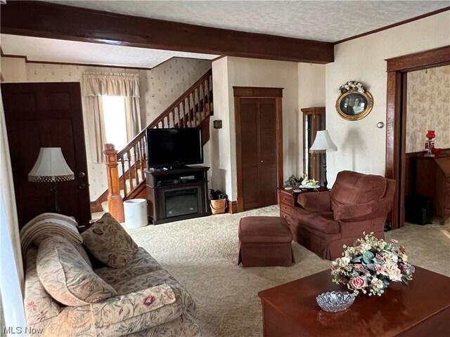 911 Grandview Ave, New Matamoras, OH 45767 - carpeted living room featuring crown molding, stairs, a textured ceiling, wallpapered walls, and beamed ceiling