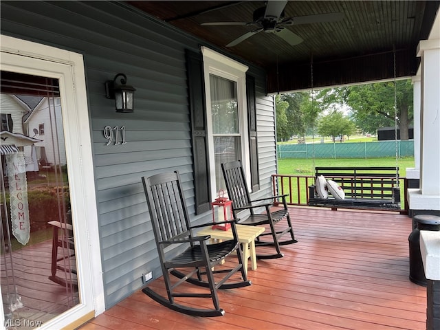 wooden deck with ceiling fan