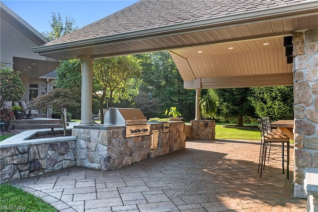 view of patio featuring exterior kitchen and grilling area