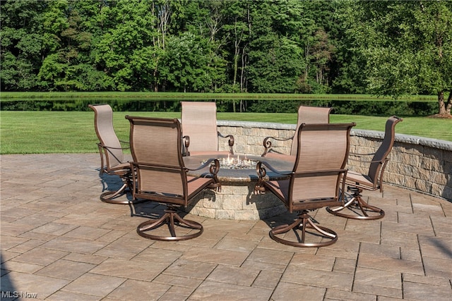 view of patio with a water view