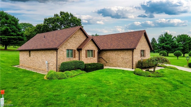 view of side of home featuring a yard