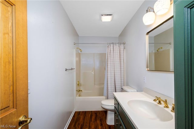 full bathroom featuring hardwood / wood-style flooring, shower / bath combination with curtain, toilet, and vanity