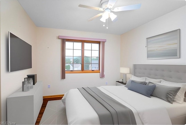 bedroom with ceiling fan and dark hardwood / wood-style flooring