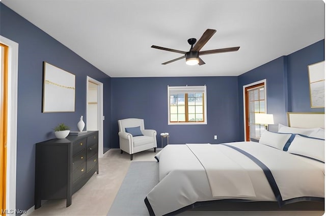 carpeted bedroom featuring ceiling fan