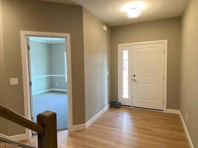 entryway with light hardwood / wood-style floors