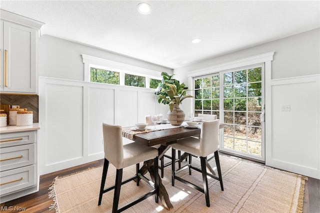 dining room with dark hardwood / wood-style flooring