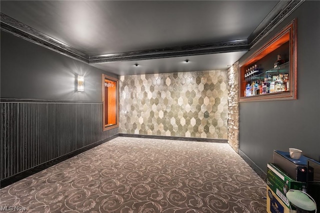 carpeted cinema room with ornamental molding