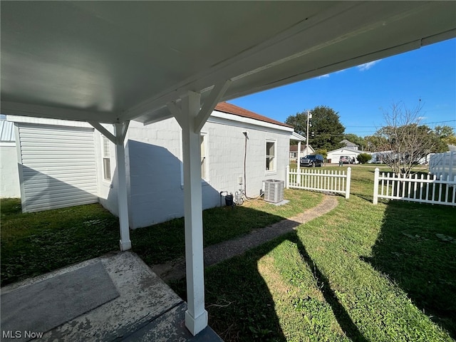 view of yard with a patio area and central AC unit