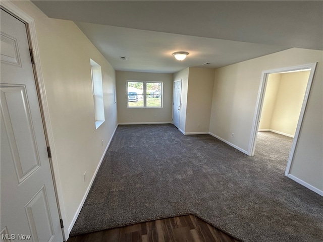 empty room with hardwood / wood-style floors