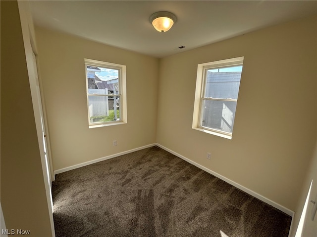 spare room featuring carpet flooring