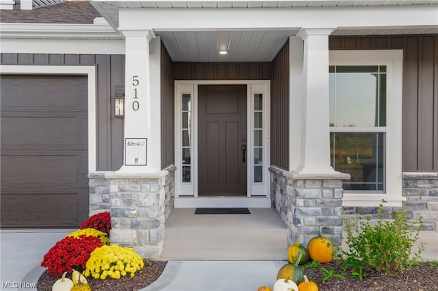 entrance to property featuring a garage