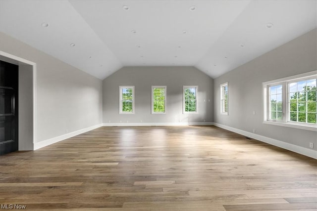 2585 Glendale Rd, Marietta, OH 45750 - unfurnished living room with baseboards, lofted ceiling, and wood finished floors