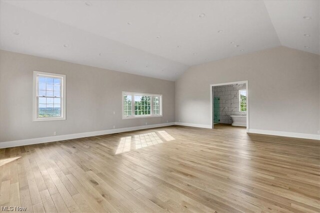 2585 Glendale Rd, Marietta, OH 45750 - unfurnished room with vaulted ceiling, light wood-style floors, and baseboards