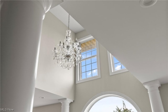 2585 Glendale Rd, Marietta, OH 45750 - room details featuring an inviting chandelier and decorative columns