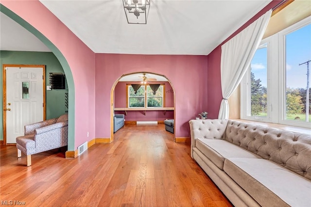 living room featuring a wealth of natural light and light wood-type flooring