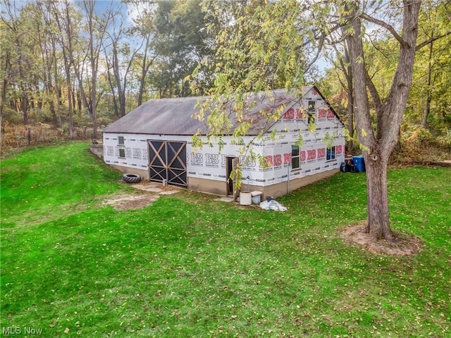 view of outdoor structure with a lawn