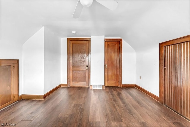 additional living space with ceiling fan, dark hardwood / wood-style flooring, and lofted ceiling