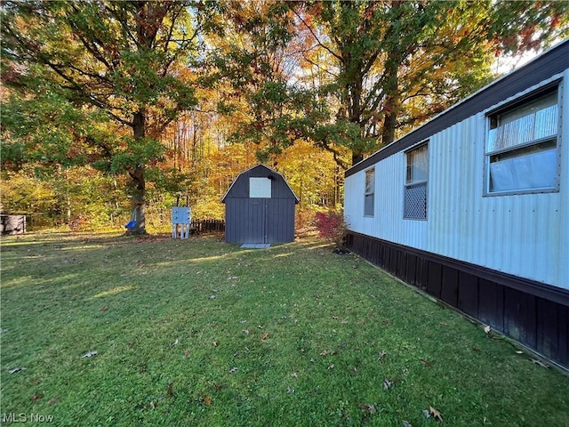 view of yard with an outbuilding and a storage shed