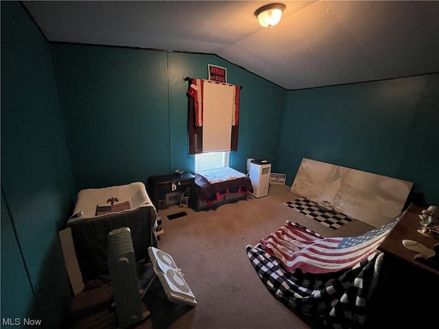 bedroom with carpet and vaulted ceiling