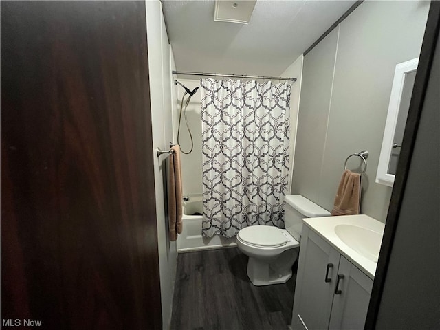 full bathroom with vanity, toilet, shower / bathtub combination with curtain, and hardwood / wood-style flooring