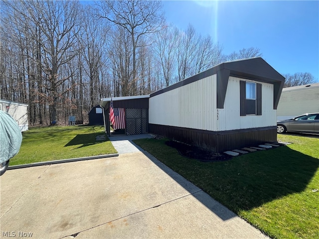 view of side of home featuring a yard