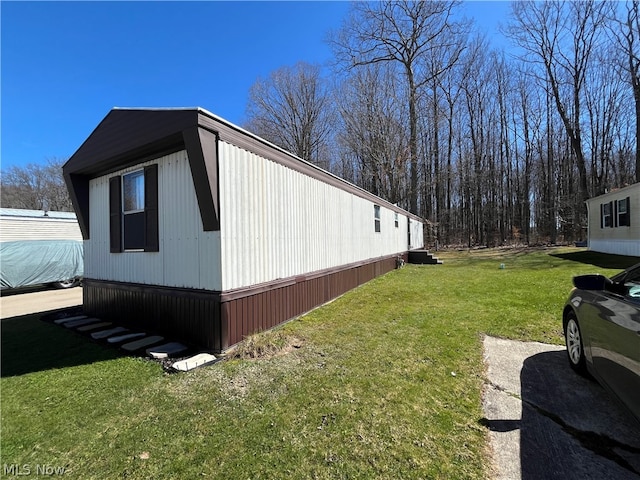 view of home's exterior featuring a lawn