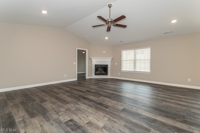 unfurnished living room with vaulted ceiling, ceiling fan, and dark hardwood / wood-style flooring