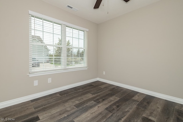 empty room featuring ceiling fan and dark hardwood / wood-style floors