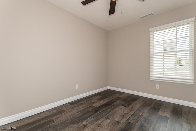 spare room with ceiling fan and dark hardwood / wood-style floors