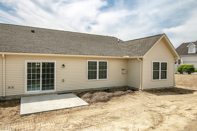 rear view of property featuring a patio