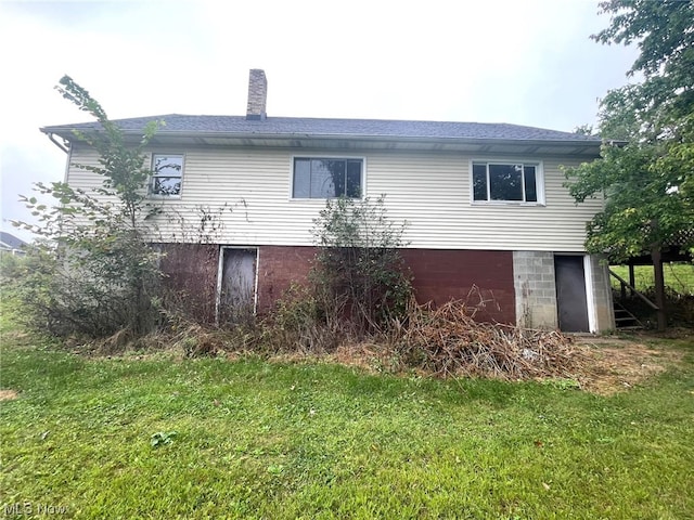 view of home's exterior featuring a yard