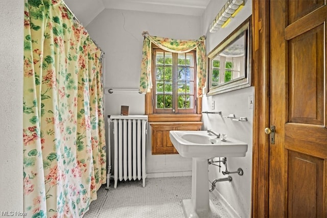 bathroom with radiator heating unit