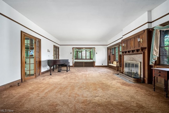 living room with carpet and a fireplace