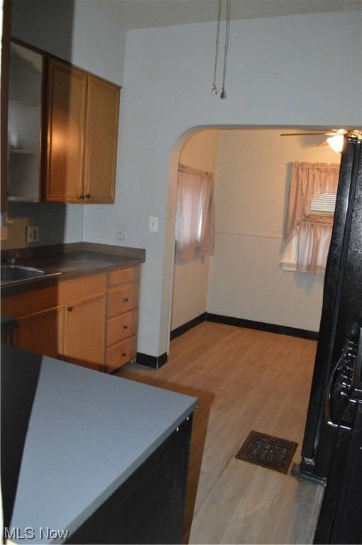 kitchen featuring light hardwood / wood-style flooring and sink