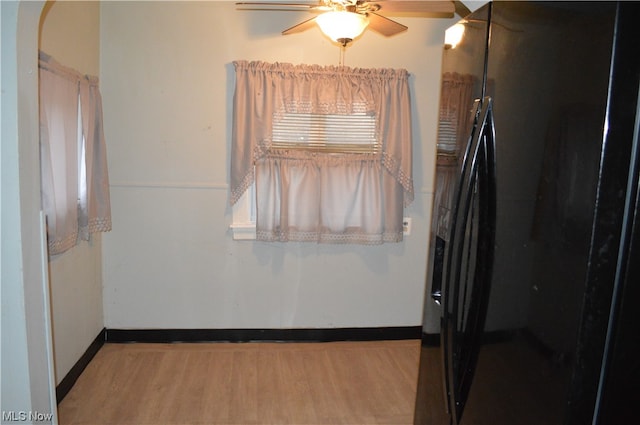 unfurnished dining area with light hardwood / wood-style floors and ceiling fan