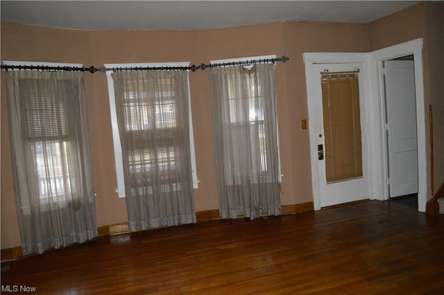 spare room featuring dark hardwood / wood-style floors