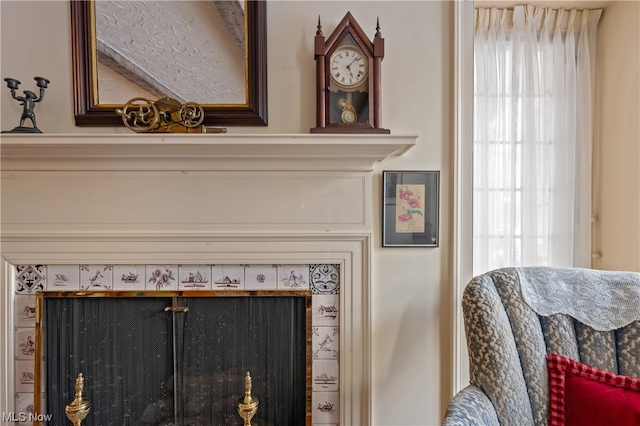 details featuring a tiled fireplace