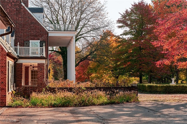 view of property exterior with a balcony