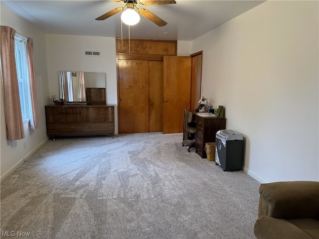 carpeted bedroom featuring ceiling fan