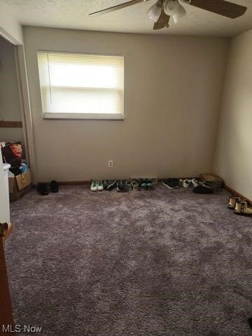 1233 Hulett Ave, Eastlake, OH 44095 - carpeted empty room featuring ceiling fan