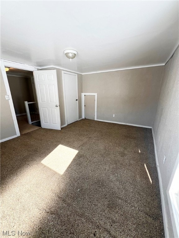 unfurnished bedroom featuring carpet flooring