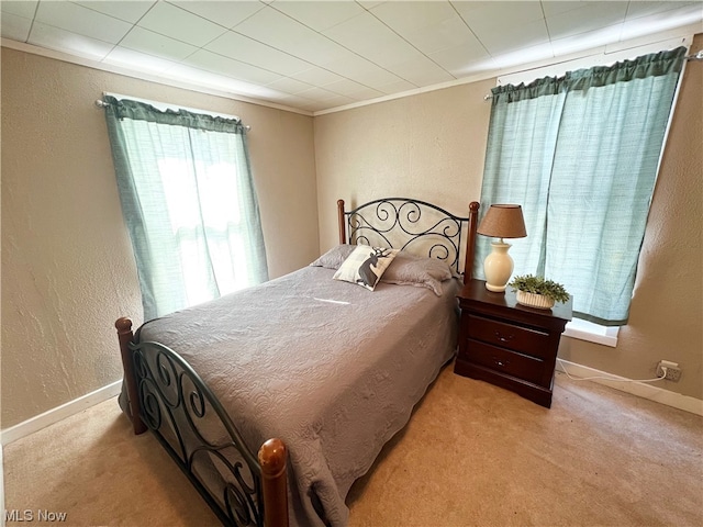 bedroom featuring light colored carpet