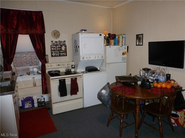 117A High St, Flushing, OH 43977 - kitchen with white appliances, stacked washer / dryer, crown molding, and dark countertops