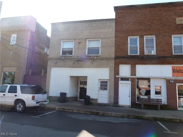 117A High St, Flushing, OH 43977 - view of front of property with brick siding and uncovered parking