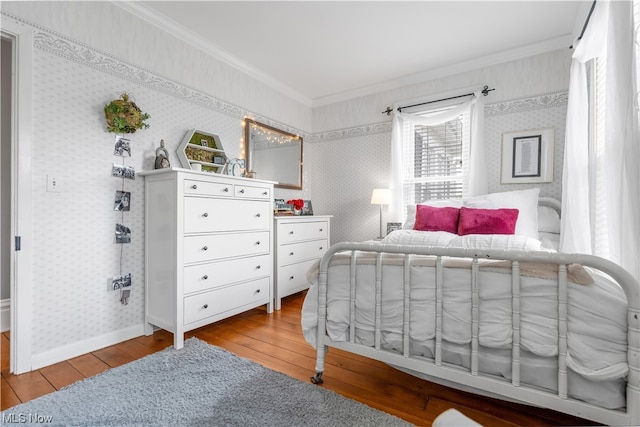 bedroom featuring crown molding and hardwood / wood-style floors