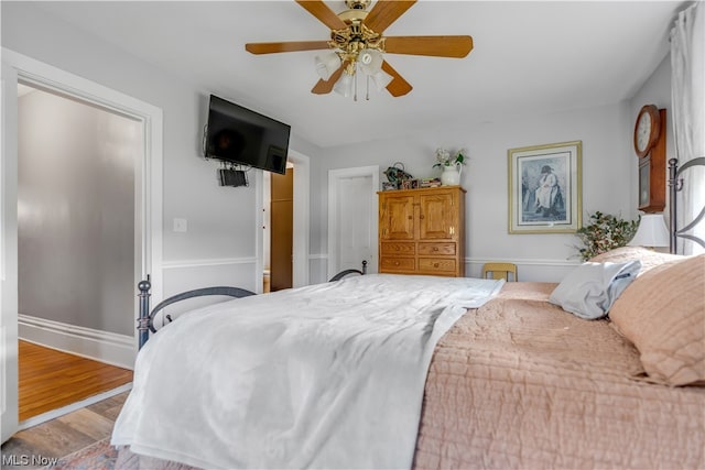 bedroom featuring ceiling fan and wood-type flooring