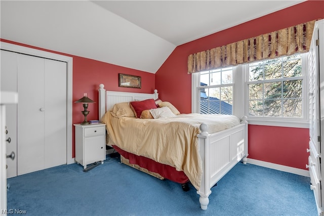 bedroom with carpet floors, a closet, and vaulted ceiling