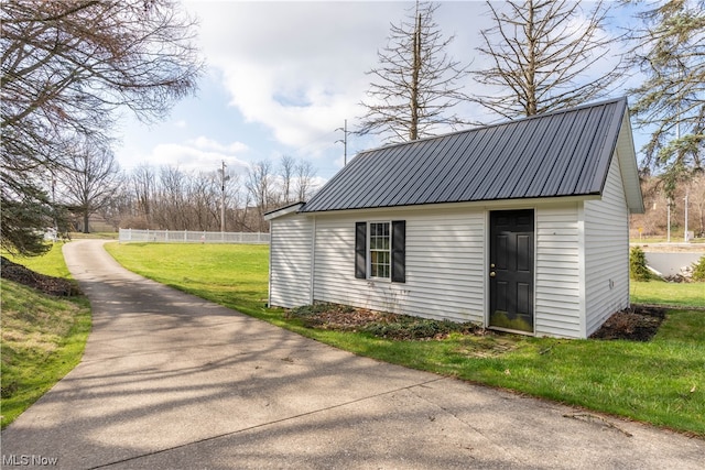 view of outdoor structure with a yard